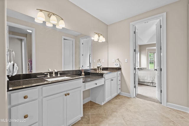 5110 Kensington Creek Dr, Southaven, MS 38672 - bathroom with double vanity, ensuite bath, and tile patterned flooring