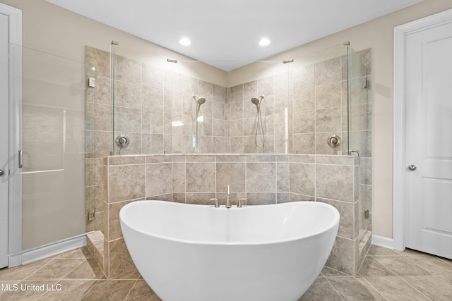 5110 Kensington Creek Dr, Southaven, MS 38672 - full bath featuring a stall shower, a freestanding bath, recessed lighting, and tile patterned flooring