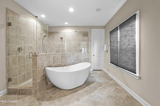 5110 Kensington Creek Dr, Southaven, MS 38672 - full bathroom with a shower stall, a freestanding tub, and recessed lighting