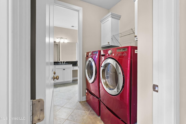 5110 Kensington Creek Dr, Southaven, MS 38672 - washroom with separate washer and dryer, light tile patterned flooring, and cabinet space