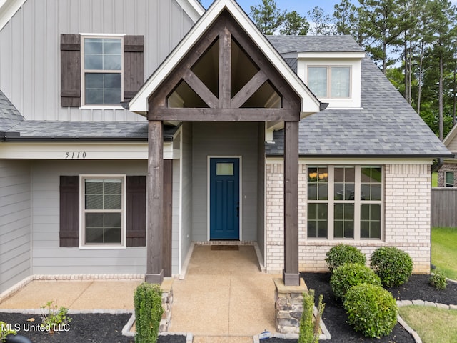 5110 Kensington Creek Dr, Southaven, MS 38672 - entrance to property with board and batten siding, a shingled roof, and brick siding