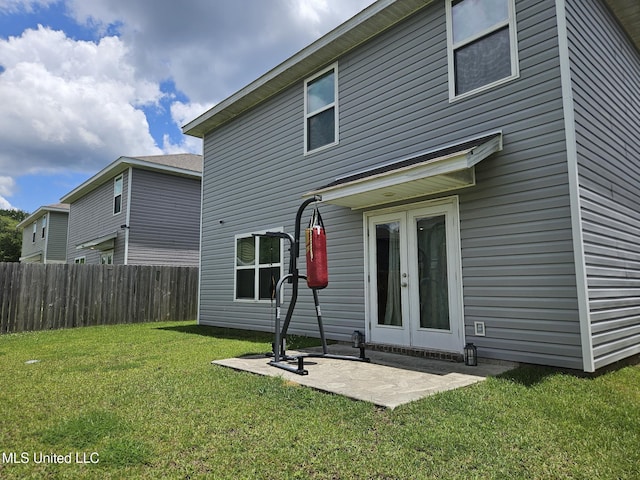 2205 Magazine St, Ocean Springs, MS 39564 - rear view of house with french doors and a patio