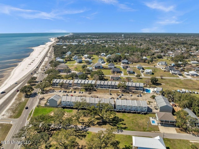 drone / aerial view featuring a water view and a beach view