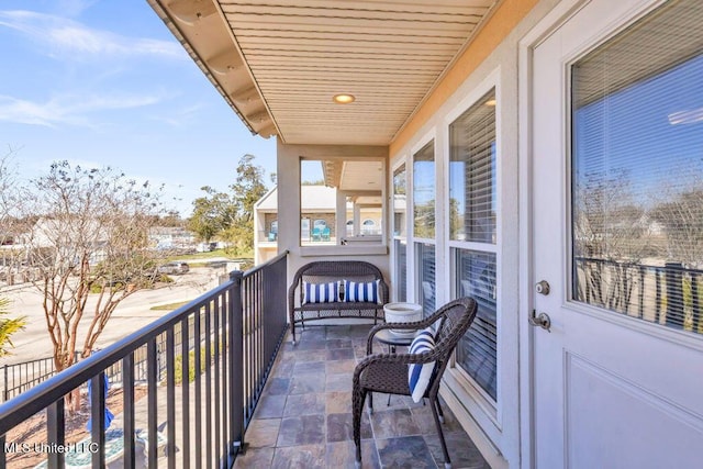 balcony featuring a sunroom