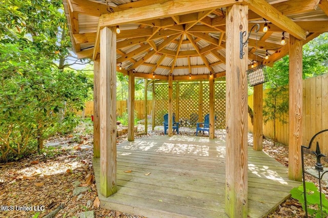 wooden deck featuring a gazebo