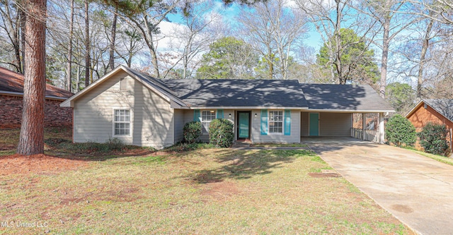 ranch-style house featuring a carport and a front lawn