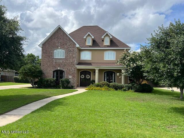 view of front of home with a front yard