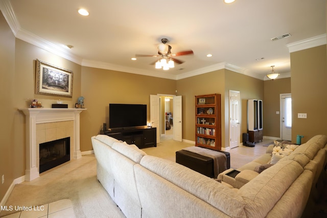 13342 E Carriage Cir, Gulfport, MS 39503 - living area featuring a ceiling fan, recessed lighting, light tile patterned floors, crown molding, and light carpet