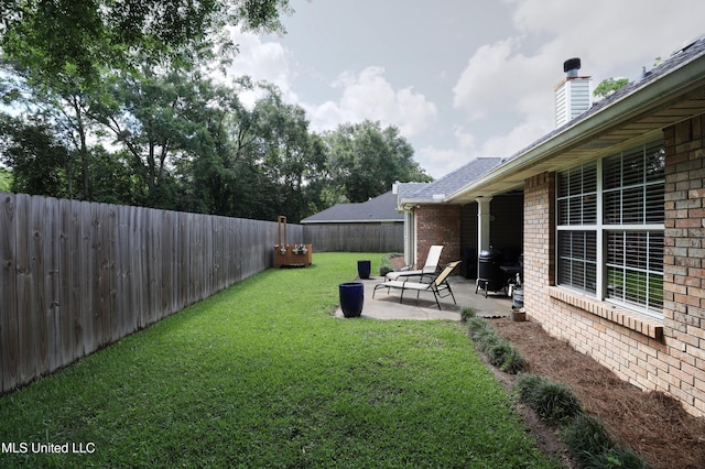 13342 E Carriage Cir, Gulfport, MS 39503 - view of yard with a patio area
