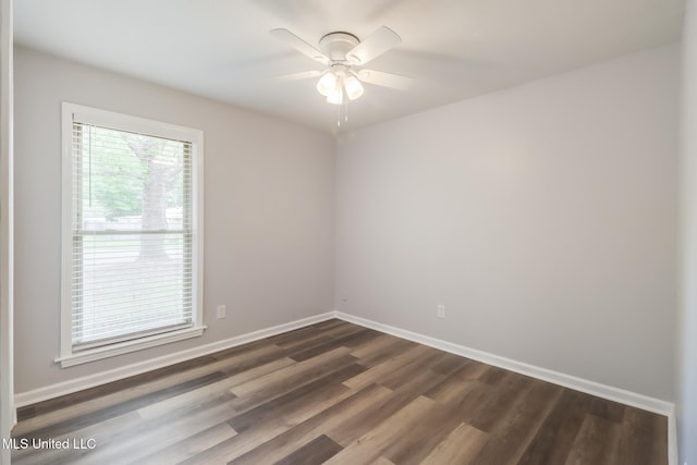 12082 Marlane Pl, Gulfport, MS 39503 - empty room with baseboards, dark wood-style flooring, and a ceiling fan