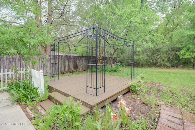 12082 Marlane Pl, Gulfport, MS 39503 - wooden deck featuring a fenced backyard and a lawn