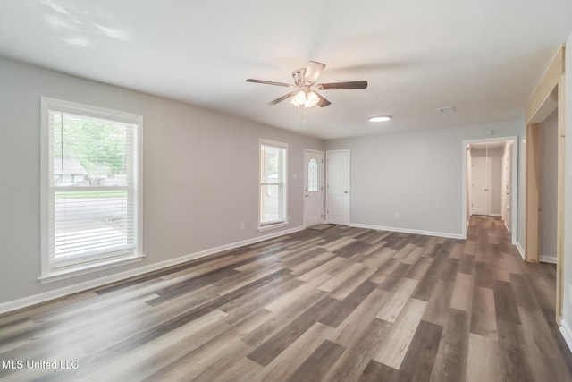 12082 Marlane Pl, Gulfport, MS 39503 - spare room featuring a wealth of natural light, ceiling fan, and baseboards
