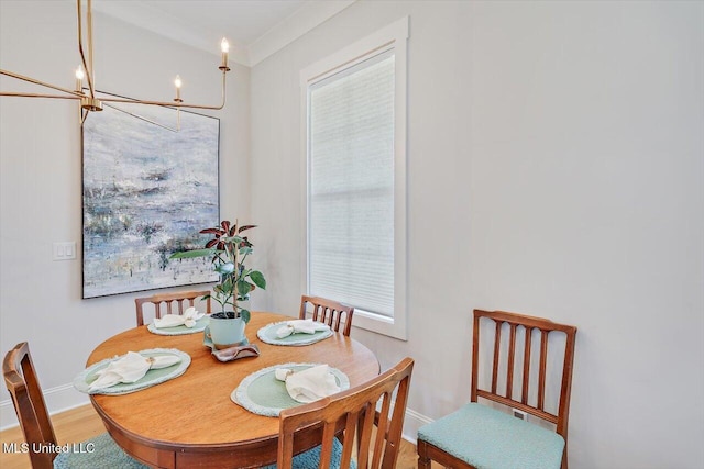 122 Seymour Dr, Madison, MS 39110 - dining space featuring a chandelier, baseboards, and wood finished floors