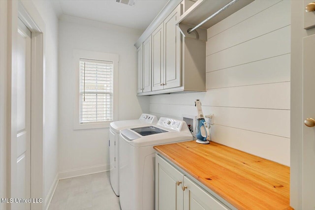 122 Seymour Dr, Madison, MS 39110 - laundry area with cabinet space, independent washer and dryer, and baseboards