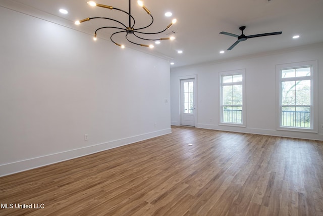 103 E 2nd St, Pass Christian, MS 39571 - unfurnished room with crown molding, wood finished floors, baseboards, and plenty of natural light