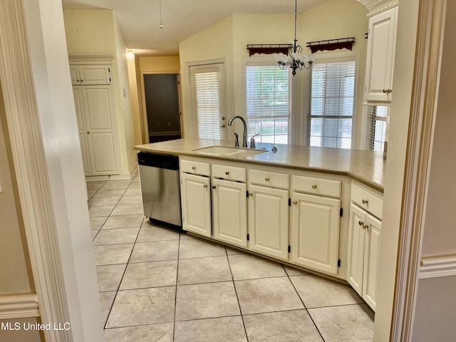 3057 Windwood Cir, Flowood, MS 39232 - kitchen with stainless steel dishwasher, a sink, light tile patterned flooring, a chandelier, and white cabinetry