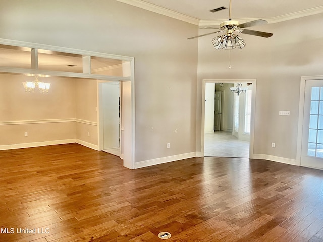3057 Windwood Cir, Flowood, MS 39232 - unfurnished room featuring a chandelier, ornamental molding, hardwood / wood-style flooring, a ceiling fan, and baseboards