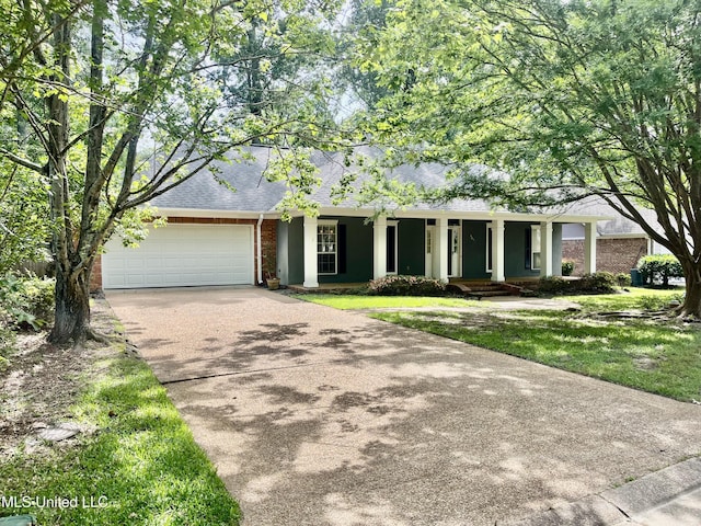 3057 Windwood Cir, Flowood, MS 39232 - view of front of property featuring brick siding, roof with shingles, a garage, concrete driveway, and covered porch