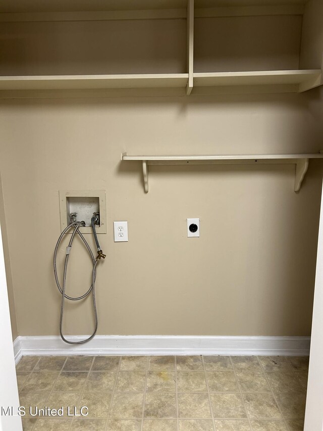 washroom with hookup for a washing machine, laundry area, hookup for an electric dryer, and baseboards