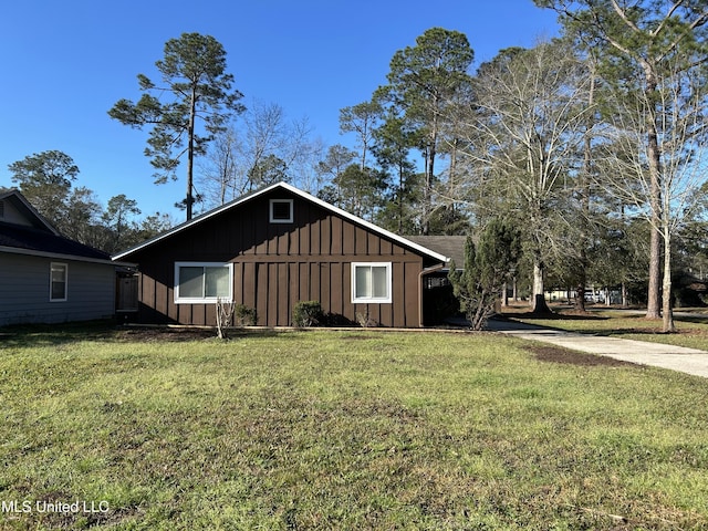 exterior space with a yard and board and batten siding