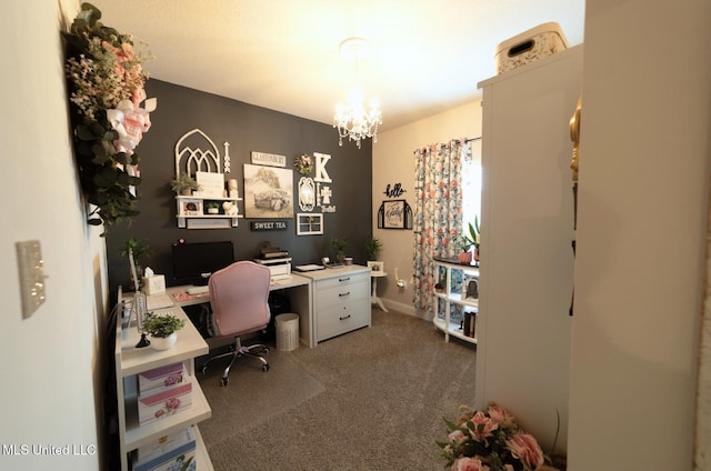 home office with carpet floors and a chandelier
