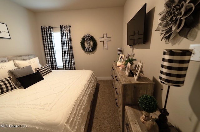 carpeted bedroom with baseboards