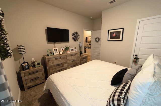 bedroom featuring carpet floors and visible vents