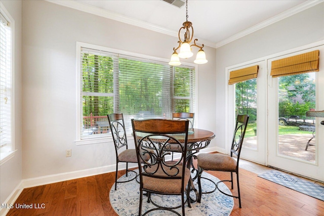 6193 Spring Hill Dr, Olive Branch, MS 38654 - dining room featuring crown molding, plenty of natural light, and light wood-type flooring