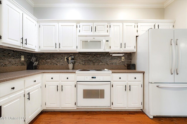 6193 Spring Hill Dr, Olive Branch, MS 38654 - kitchen with white appliances, crown molding, decorative backsplash, light wood-style flooring, and white cabinetry
