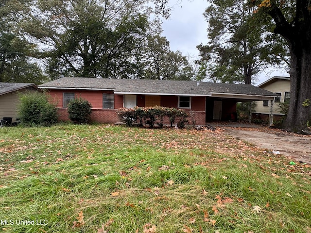 single story home featuring a carport