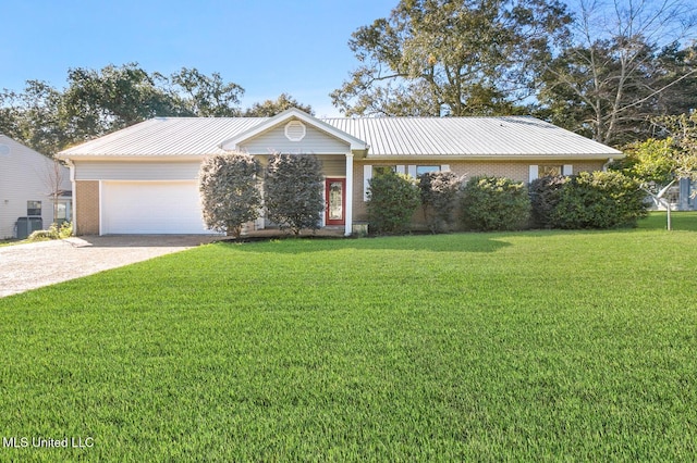 ranch-style house with central AC unit, a garage, and a front yard