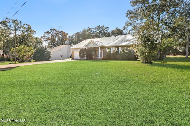 ranch-style house with a garage and a front yard