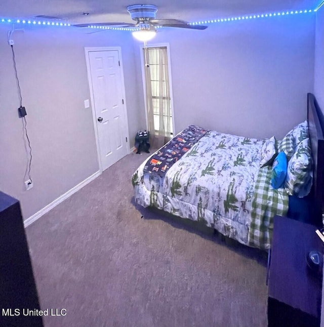 unfurnished bedroom featuring ceiling fan and carpet