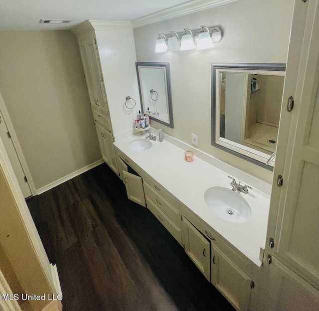 bathroom with vanity, wood-type flooring, and crown molding