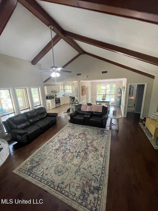 living room featuring high vaulted ceiling, dark wood-type flooring, beamed ceiling, and ceiling fan