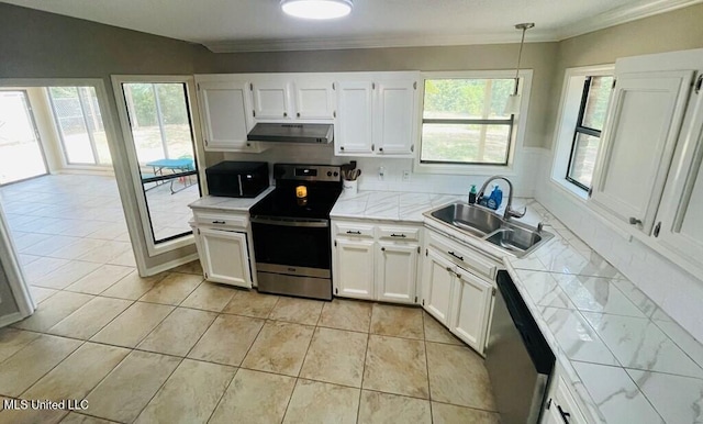 kitchen with decorative light fixtures, white cabinetry, stainless steel appliances, sink, and light tile patterned flooring