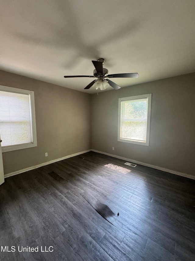 1870 Wisteria Dr, Jackson, MS 39204 - spare room featuring ceiling fan, baseboards, and dark wood-style floors