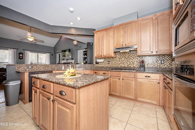 kitchen with stainless steel microwave, tasteful backsplash, a center island, light tile patterned floors, and kitchen peninsula