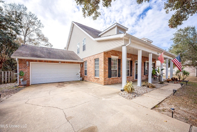 view of front facade featuring a porch and a garage