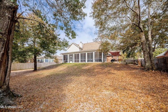 rear view of house with a sunroom