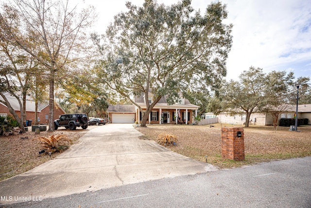 single story home featuring a garage and covered porch