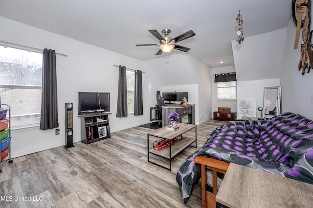 living room with hardwood / wood-style flooring and ceiling fan