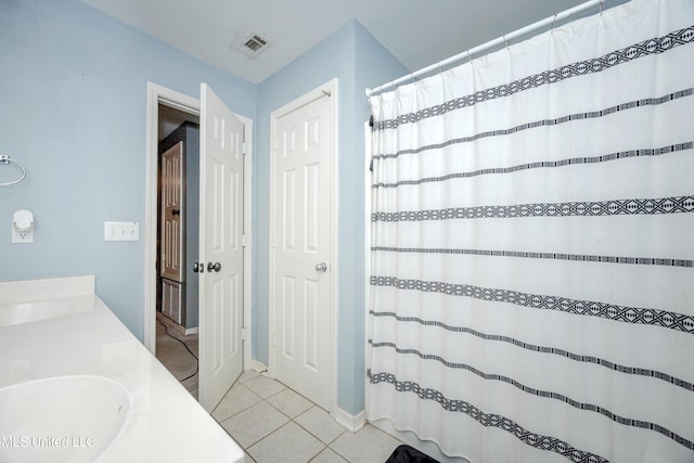 bathroom featuring vanity and tile patterned floors