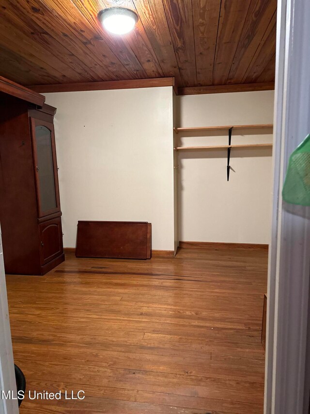 interior space featuring hardwood / wood-style floors and wooden ceiling