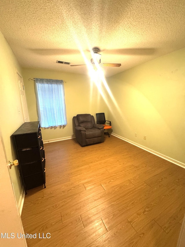 167 Tackett Run, Southaven, MS 38671 - sitting room with a textured ceiling, a ceiling fan, and wood finished floors