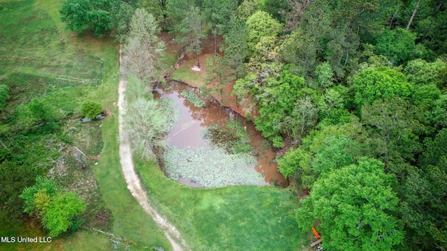 aerial view featuring a wooded view