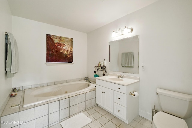 bathroom with toilet, a jetted tub, tile patterned flooring, and vanity