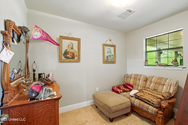 sitting room featuring carpet, baseboards, and visible vents