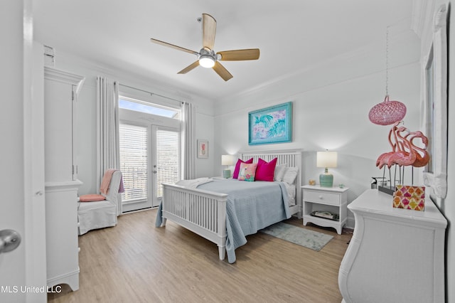 bedroom featuring crown molding, light wood finished floors, a ceiling fan, and access to exterior