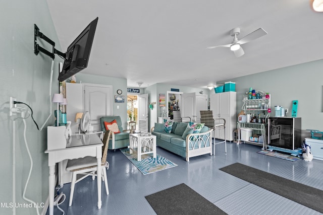 living area with a ceiling fan